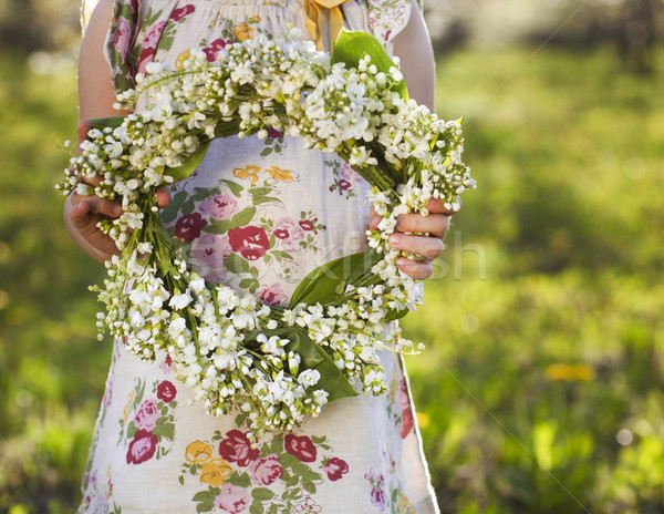Little girl holding wreath from lily of the valley  Stock photo © dashapetrenko