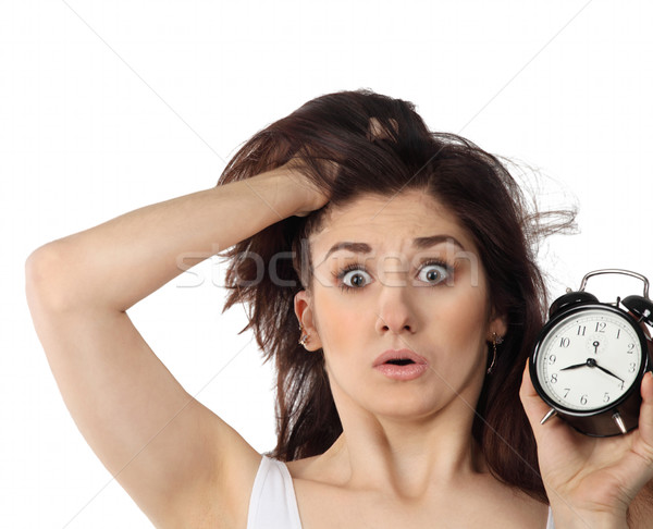 Surprised woman holding clock Stock photo © dashapetrenko