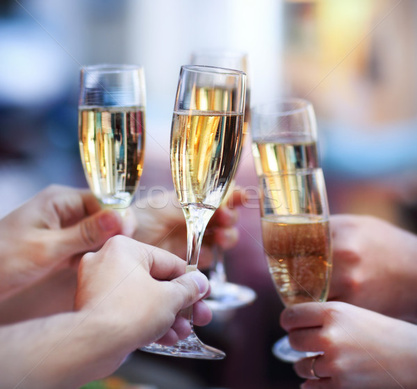 People holding glasses of champagne making a toast Stock photo © dashapetrenko