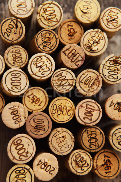Stock photo: Dated wine bottle corks on the wooden background
