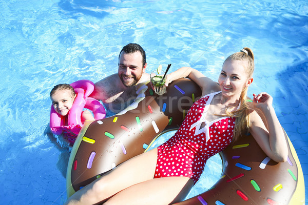 Happy family having fun in pool Stock photo © dashapetrenko