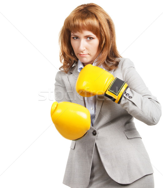 Young businesswoman wearing boxing gloves Stock photo © dashapetrenko