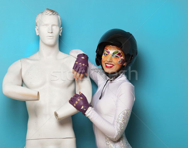 Model with bright creative make up with helmet and male dummy Stock photo © dashapetrenko