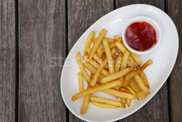 French fries with ketchup on white plate  Stock photo © dashapetrenko