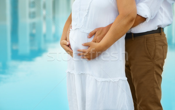 Man and young pregnant woman hugging outdoors Stock photo © dashapetrenko