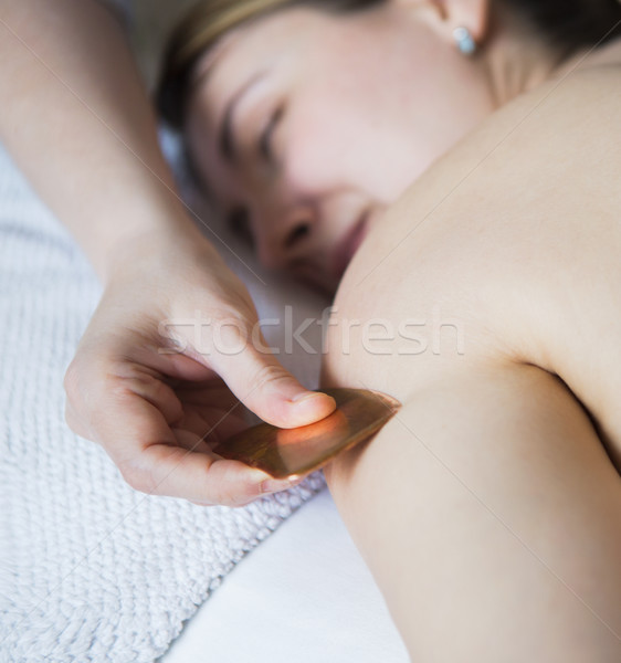 Young woman take back treatment at health spa Stock photo © dashapetrenko