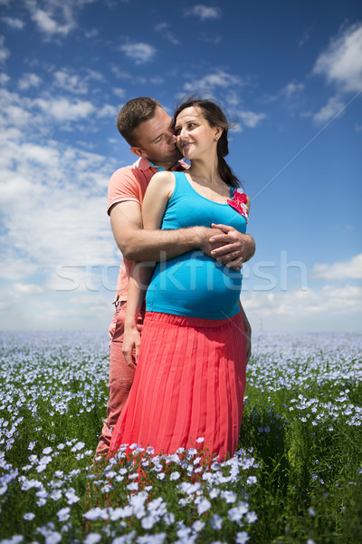 Young beautiful pregnant couple in linen field Stock photo © dashapetrenko