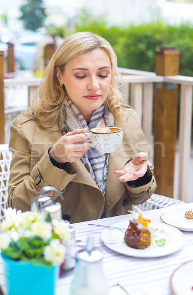 Stock photo: Close up happy adult blond woman with cup of coffee 