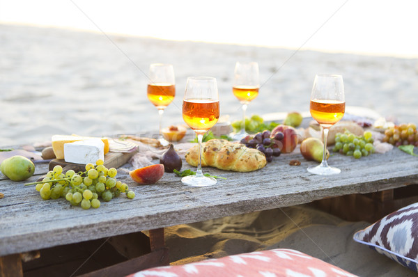 Beach picnic table with rose wine Stock photo © dashapetrenko