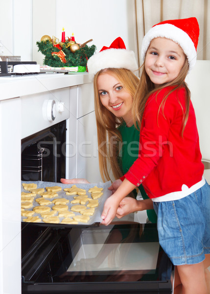 Little girl with her mother baking Christmas cookies  Stock photo © dashapetrenko