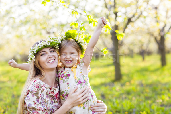 Happy mother and her little daughter in the spring day  Stock photo © dashapetrenko