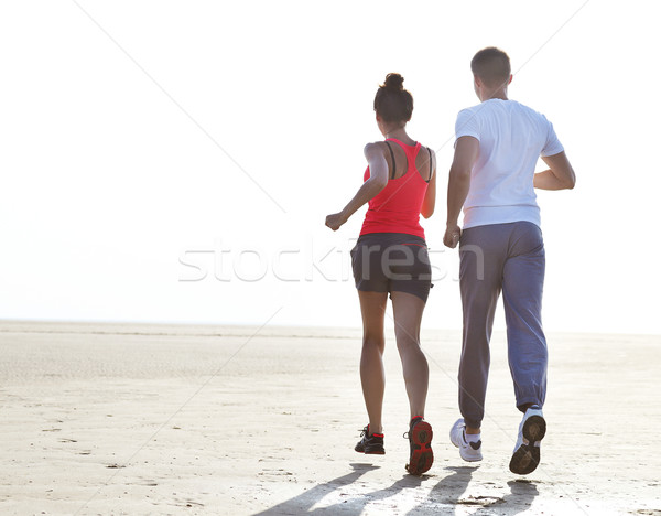 Runners training outdoors working out in nature against blue sky Stock photo © dashapetrenko