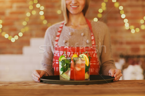 Young pretty woman with red and green cocktails on tray Stock photo © dashapetrenko