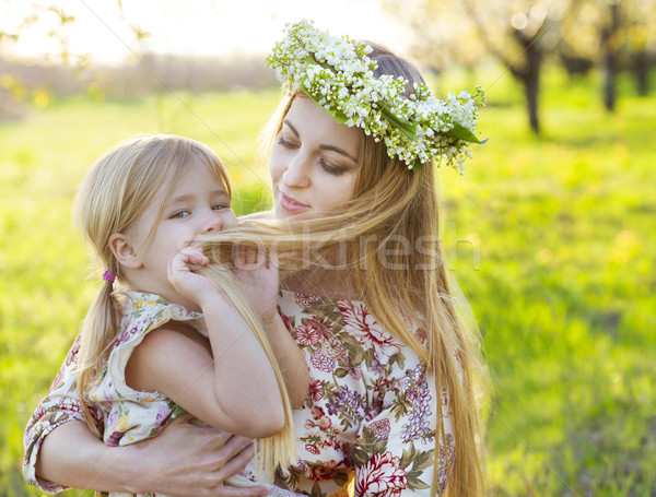 Happy mother and her little daughter in the spring day Stock photo © dashapetrenko