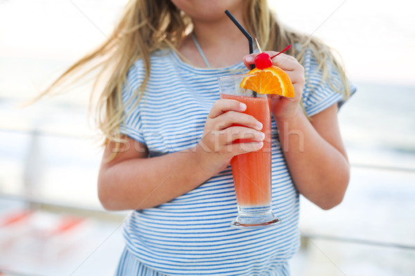 небольшой девушки питьевой экзотический сока пляж Сток-фото © dashapetrenko