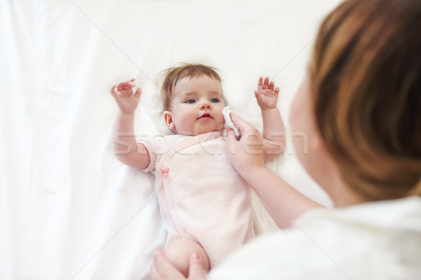 Young woman in the room with baby Stock photo © dashapetrenko
