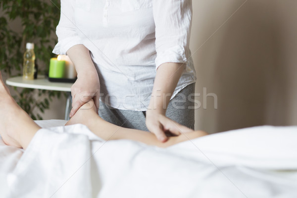 Foot massage treatment in asian spa salon Stock photo © dashapetrenko