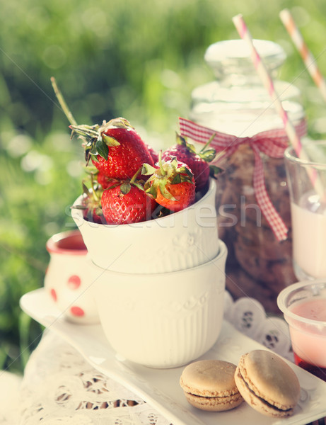 Picnic with strawberry, cookies, strawberry milk, jelly and maca Stock photo © dashapetrenko