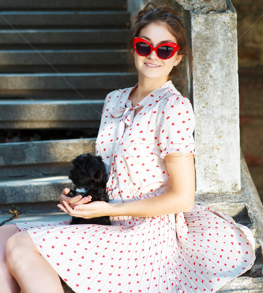 Young brunette woman hugging her lap dog puppy Stock photo © dashapetrenko