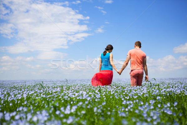 Young happy beautiful pregnant couple in linen field Stock photo © dashapetrenko