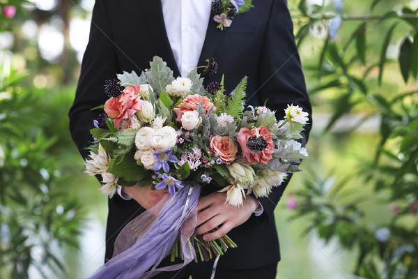 Groom holding beautiful bouquet in his hands Stock photo © dashapetrenko