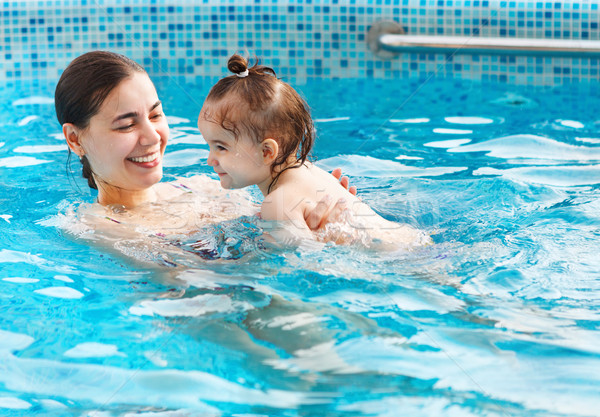 One year baby girl at her first swimming lesson with mother  Stock photo © dashapetrenko