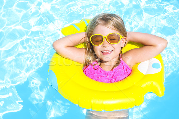 Happy child in swimming pool. Summer vacation  Stock photo © dashapetrenko