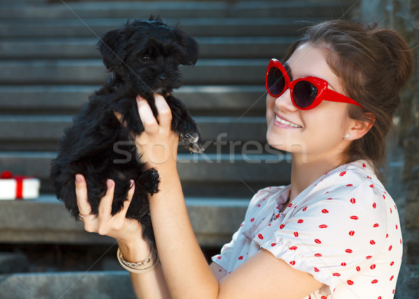 Young brunette woman hugging her lap dog puppy Stock photo © dashapetrenko