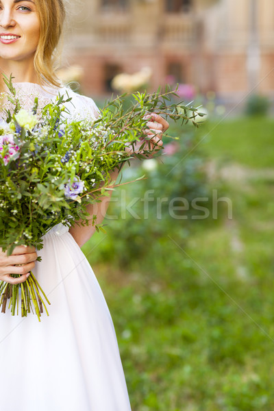 Beautiful wedding bouquet in the hands of the bride Stock photo © dashapetrenko