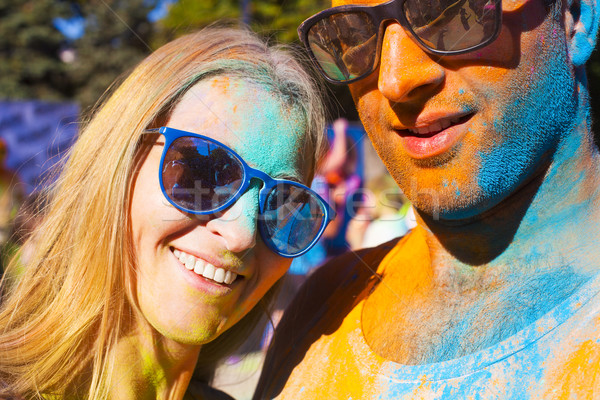 Happy couple in love on holi color festival Stock photo © dashapetrenko