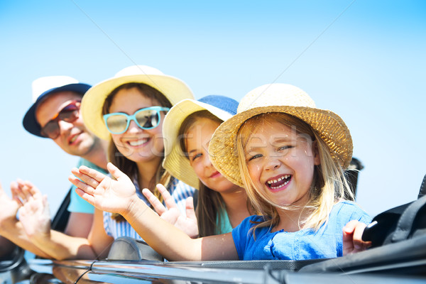 Portrait of a smiling family with two children at beach in the c Stock photo © dashapetrenko