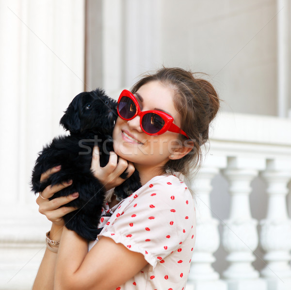 Young brunette woman hugging her lap dog puppy Stock photo © dashapetrenko