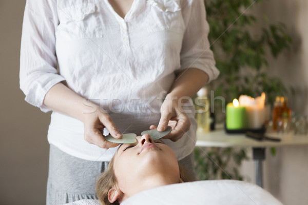 Face massage or beauty treatment in spa salon Stock photo © dashapetrenko