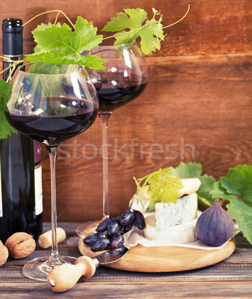 Still life with glasses of red wine and chesse Stock photo © dashapetrenko