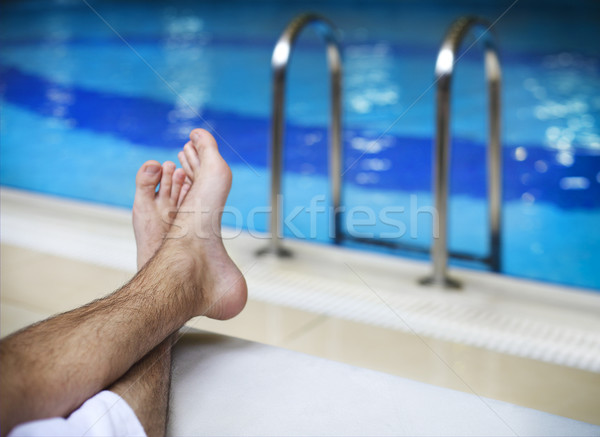 Sunbathing by the hotel tourist resort swimming pool. Lazy time Stock photo © dashapetrenko