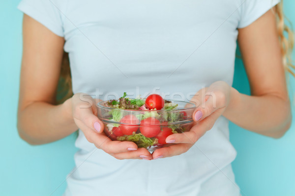 Female model holding green salad Stock photo © dashapetrenko