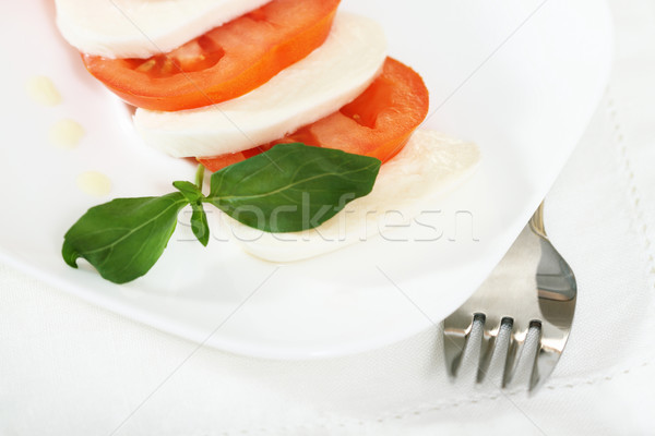 Caprese salade mozzarella tomaten basilicum olijfolie voedsel Stockfoto © dashapetrenko