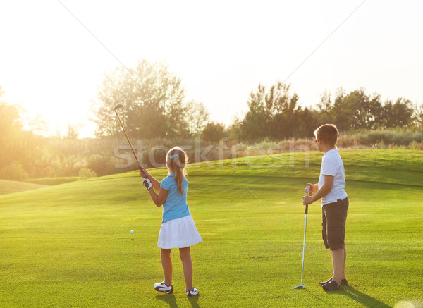 Casual ninos golf campo palos de golf Foto stock © dashapetrenko