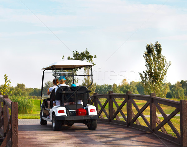 Young sportive people in the golfcar Stock photo © dashapetrenko