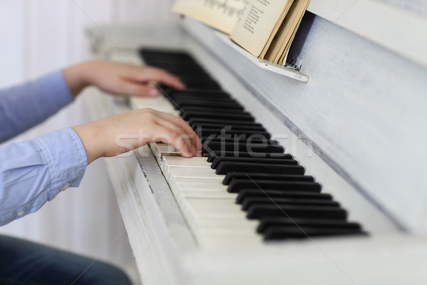 Close up of hands playing piano. Concept of music and entertainm Stock photo © dashapetrenko