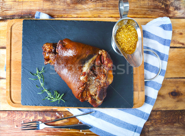 Roasted pork leg (rulka) served on the wooden table Stock photo © dashapetrenko