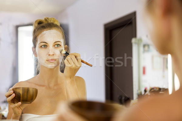 Young beautiful woman in a mask for the face of the therapeutic  Stock photo © dashapetrenko