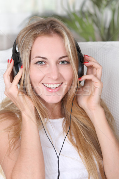 Blond beauty girl wearing headphones Stock photo © dashapetrenko