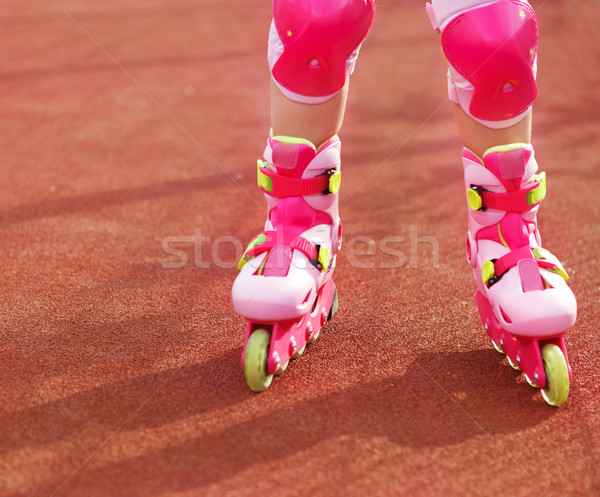 Stock photo: Rollerblades / inline skates of a child closeup in action outdoo