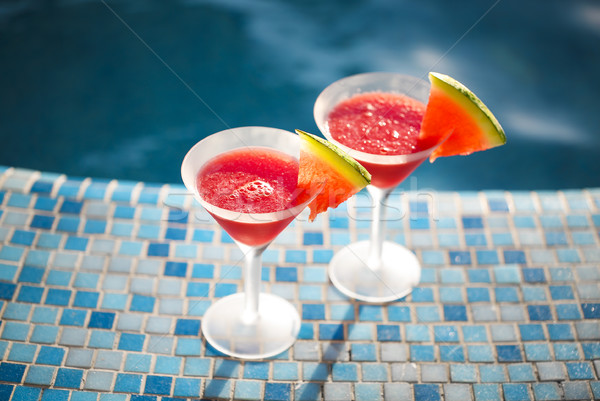 Glasses of watermelon cocktail near the pool  Stock photo © dashapetrenko