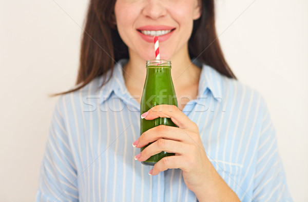 Closeup of happy beautiful fit girl with fresh green juice Stock photo © dashapetrenko