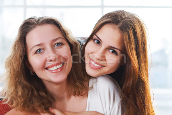 Portrait of a mother and teen daughter being close and hugging  Stock photo © dashapetrenko