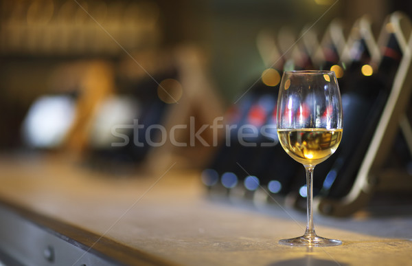 Wine bottles on a wooden shelf. Wine bar.  Stock photo © dashapetrenko