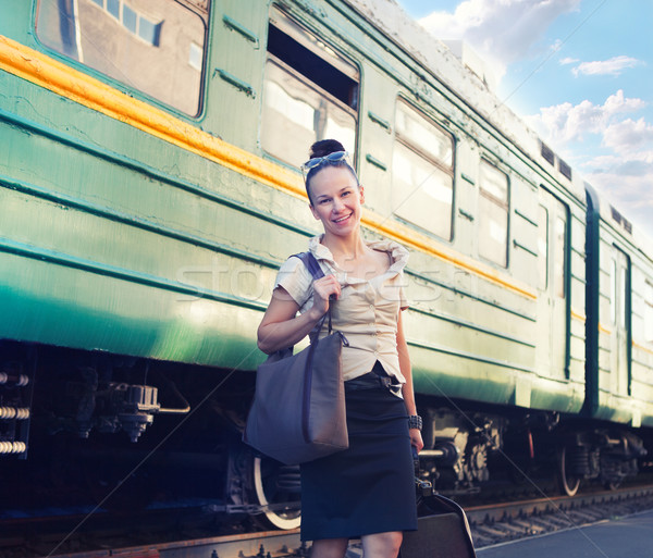 Woman with a suitcase standing on the platform  Stock photo © dashapetrenko