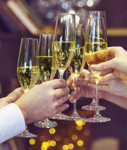 People holding glasses of champagne making a toast Stock photo © dashapetrenko